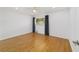 Bright bedroom showcasing wood floors, a ceiling fan, and a large window at 8712 Sw 92Nd St # C, Ocala, FL 34481