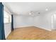 Well-lit bedroom with wood floors, ceiling fan, and natural light from the window at 8712 Sw 92Nd St # C, Ocala, FL 34481
