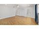 Spacious bedroom featuring light wood floors, a ceiling fan, and ensuite bathroom at 8712 Sw 92Nd St # C, Ocala, FL 34481