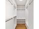 Walk-in closet with custom built-in shelving and ample storage space at 8712 Sw 92Nd St # C, Ocala, FL 34481