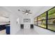 The dining area includes a beverage cooler, a ceiling fan and views to the outside at 8712 Sw 92Nd St # C, Ocala, FL 34481