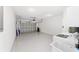 Spacious garage with washer and dryer hookups, white paint and sealed flooring at 8712 Sw 92Nd St # C, Ocala, FL 34481