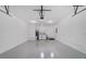 Spacious garage featuring laundry area and epoxy flooring at 8712 Sw 92Nd St # C, Ocala, FL 34481