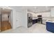 Modern kitchen with stainless steel appliances and white marbled floors at 8712 Sw 92Nd St # C, Ocala, FL 34481