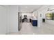 This modern kitchen features stainless steel appliances, white cabinets, and marble tile floors at 8712 Sw 92Nd St # C, Ocala, FL 34481