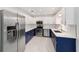 This modern kitchen features stainless steel appliances, white cabinets, and updated countertops at 8712 Sw 92Nd St # C, Ocala, FL 34481