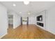 Open concept living room with modern ceiling fan and fireplace at 8712 Sw 92Nd St # C, Ocala, FL 34481