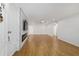Spacious living room with modern fireplace and hardwood floors at 8712 Sw 92Nd St # C, Ocala, FL 34481