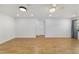 Bright living room boasts wood floors, recessed lighting, and a ceiling fan at 8712 Sw 92Nd St # C, Ocala, FL 34481