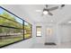 Living room featuring large picture windows and a door leading to the outdoor area at 8712 Sw 92Nd St # C, Ocala, FL 34481