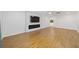 Spacious living room featuring hardwood floors, recessed lighting, and a modern fireplace feature wall with a TV at 8712 Sw 92Nd St # C, Ocala, FL 34481