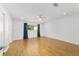 Spacious main bedroom with hardwood floors, ceiling fan and a sun-filled window at 8712 Sw 92Nd St # C, Ocala, FL 34481