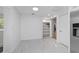 White tile floors and closet with bright open shelves offer storage in this pantry at 8712 Sw 92Nd St # C, Ocala, FL 34481