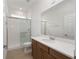 Bathroom featuring a quartz countertop vanity and glass-enclosed shower at 8783 Sw 69Th Place Rd, Ocala, FL 34481