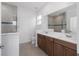 Modern bathroom with tile flooring, double sink vanity and large mirror at 8783 Sw 69Th Place Rd, Ocala, FL 34481