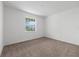 Bright bedroom with neutral carpet and a window providing natural light at 8783 Sw 69Th Place Rd, Ocala, FL 34481