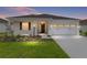Charming single-story home with a well-manicured lawn, two car garage and inviting front entrance at 8783 Sw 69Th Place Rd, Ocala, FL 34481