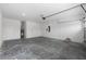 Spacious garage with concrete floor and white walls with electrical boxes at 8783 Sw 69Th Place Rd, Ocala, FL 34481