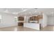 Bright, open-concept living space featuring modern kitchen, recessed lighting and tile floors at 8783 Sw 69Th Place Rd, Ocala, FL 34481