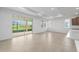 Expansive living area featuring sliding glass doors, tiled floors, and recessed lighting at 8783 Sw 69Th Place Rd, Ocala, FL 34481