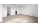 Empty main bedroom showing neutral colored carpet, white walls, and multiple doors at 8783 Sw 69Th Place Rd, Ocala, FL 34481