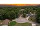 Overhead view of the property in a tranquil neighborhood surrounded by mature trees at 9 Pine Radial Ct, Ocala, FL 34472