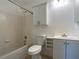 Bright bathroom featuring a shower-tub combo and modern white vanity with storage at 9 Pine Radial Ct, Ocala, FL 34472