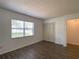 Inviting bedroom with wood-look floors, a closet, and ample natural light from a window at 9 Pine Radial Ct, Ocala, FL 34472