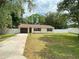 A well kept single Gathering home with a garage, manicured lawn and modern windows at 9 Pine Radial Ct, Ocala, FL 34472