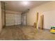 Spacious garage with a large door, side entry, and ample room for parking and storage at 9 Pine Radial Ct, Ocala, FL 34472