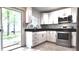 Bright kitchen with stainless appliances and backyard access at 9 Pine Radial Ct, Ocala, FL 34472