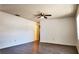 Spacious living room features modern flooring and a ceiling fan at 9 Pine Radial Ct, Ocala, FL 34472