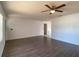 Open living area featuring modern flooring and a ceiling fan at 9 Pine Radial Ct, Ocala, FL 34472