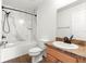 Bathroom features white marble-style shower, toilet, sink with brown countertops, and decorative bronze hardware at 97 Dogwood Cir, Ocala, FL 34472