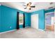 Bright bedroom with carpet, ceiling fan, and a closet offers ample storage at 97 Dogwood Cir, Ocala, FL 34472