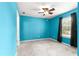 Cozy bedroom featuring a ceiling fan, carpeted floor, and a window for natural light at 97 Dogwood Cir, Ocala, FL 34472