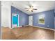 Spacious main bedroom featuring vaulted ceiling, wood-look floors, and a bright, airy feel at 97 Dogwood Cir, Ocala, FL 34472