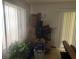 Bright living area with tile floors and large window. (Moving boxes in evidence) at 9920 Sw 102Nd Pl, Ocala, FL 34481