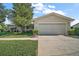 Charming single-story home with a well-maintained front yard and a two-car garage at 10347 Se 178Th Pl, Summerfield, FL 34491