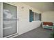 Cozy covered front porch with a seating area, perfect for relaxing outdoors at 10347 Se 178Th Pl, Summerfield, FL 34491
