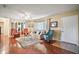 Bright living room with large windows, hardwood floors, and elegant decor at 10347 Se 178Th Pl, Summerfield, FL 34491