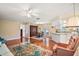 Open concept living and dining area with beautiful hardwood floors and ample natural light at 10347 Se 178Th Pl, Summerfield, FL 34491