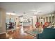 Open concept living and dining area with beautiful hardwood floors and ample natural light at 10347 Se 178Th Pl, Summerfield, FL 34491