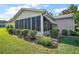 Enclosed screened-in back porch providing an outdoor living space at 10347 Se 178Th Pl, Summerfield, FL 34491