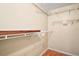 Empty walk-in closet featuring shelving units to maximize storage and organization at 10347 Se 178Th Pl, Summerfield, FL 34491