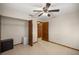 Comfortable bedroom featuring a closet, ceiling fan, and ensuite bathroom for added convenience at 11091 Sw 76Th Ter, Ocala, FL 34476