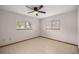 An airy, empty bedroom with tile floors and natural light, ready for personal touches at 11091 Sw 76Th Ter, Ocala, FL 34476