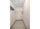 Walk-in closet providing ample storage space with shelving and tiled flooring, maximizing organization at 11091 Sw 76Th Ter, Ocala, FL 34476