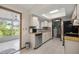 Efficient kitchen with stainless steel appliances, tile backsplash, and ample cabinet space at 11091 Sw 76Th Ter, Ocala, FL 34476