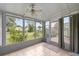 Relaxing screened patio with tiled flooring and views of the backyard, ideal for outdoor enjoyment at 11091 Sw 76Th Ter, Ocala, FL 34476